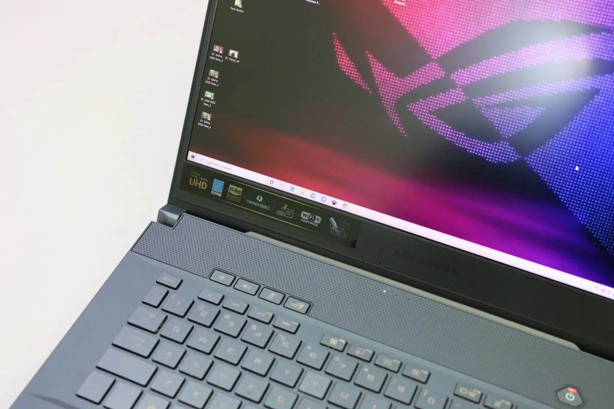 Close-up of laptop keyboard and vibrant gaming screen — gaming laptop screen size comparison 14 vs 16 vs 18 inch