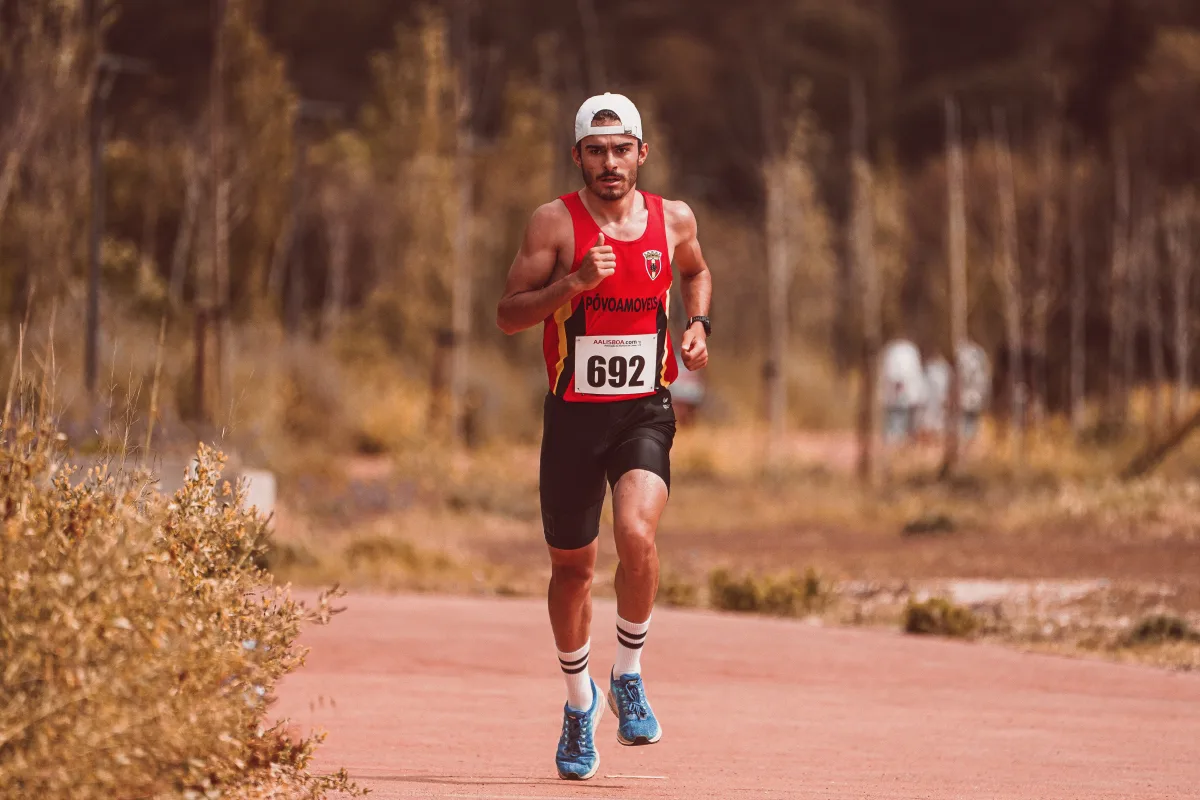 Athletic runner competing in an outdoor marathon on a sunny day
