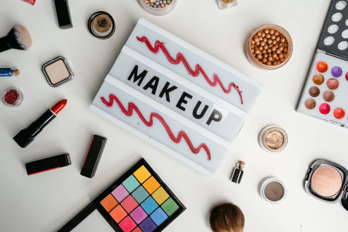 Vibrant flat lay of makeup products and color palettes
