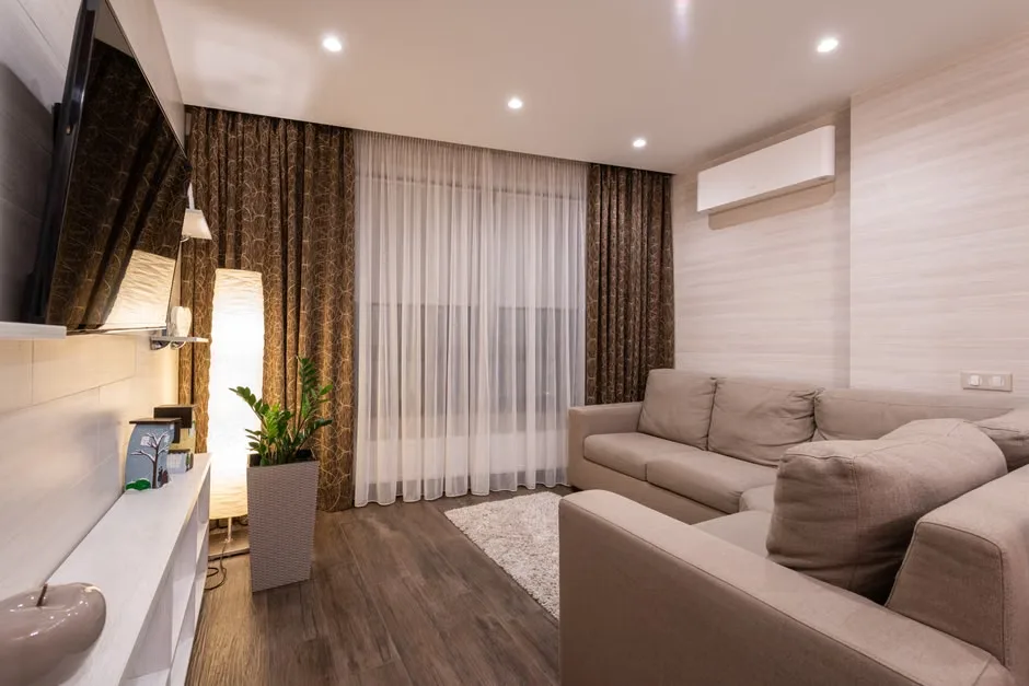 Stylish open-plan living room with wooden flooring